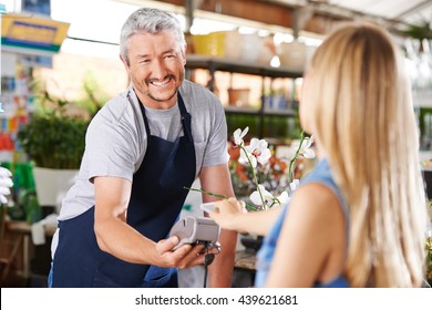 Cashless Payment With Smartphone In Hardware Store At The Checkout