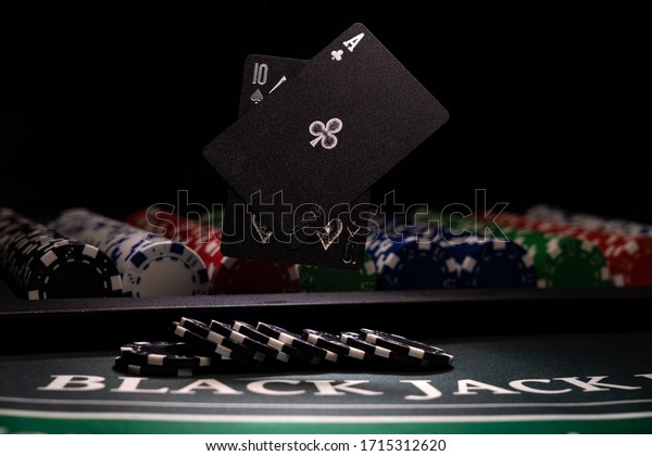 A Casino\
BlackJack table with black\
cards