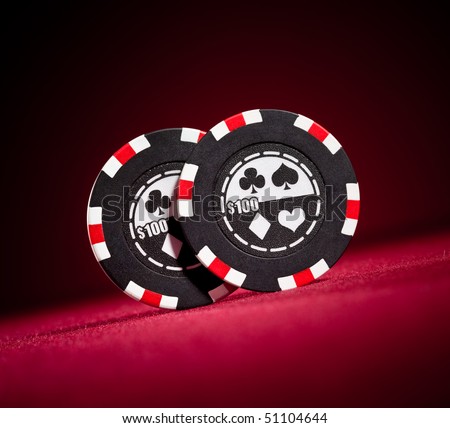 Casino gambling chips on the red