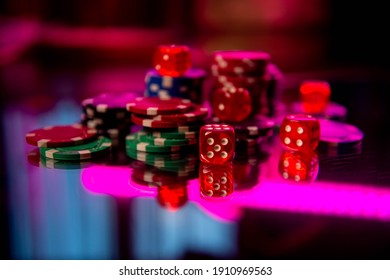 Casino. Poker. Game pieces and dice are on the table. Game chips for betting in gambling. Dice. Poker chips. - Powered by Shutterstock