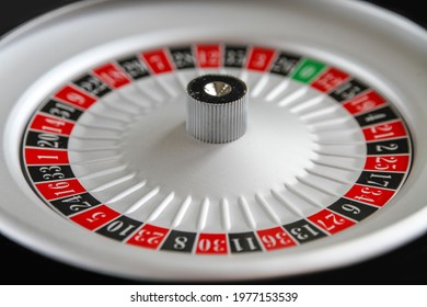 Casino Roulette Wheel Close Up View. Black Background