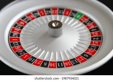 Casino Roulette Wheel Close Up View. Black Background