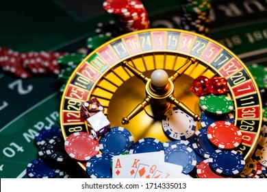 Casino set with Roulette, cards, dice and chips on BlackJack mat