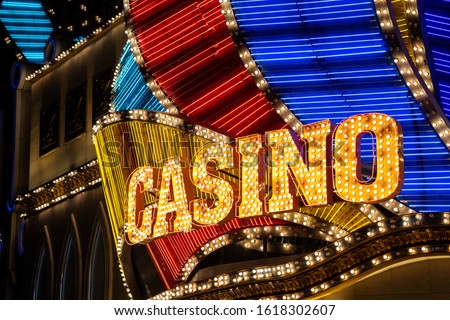 Casino sign lit with bulbs and neon lights