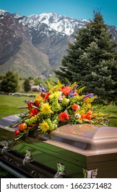 casket with flowers and mountain background - Shutterstock ID 1662371482