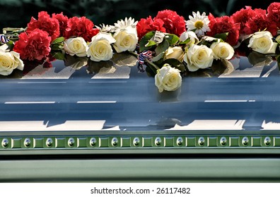 Casket  With Flowers On Top Graveside At Arlington National Cemetery