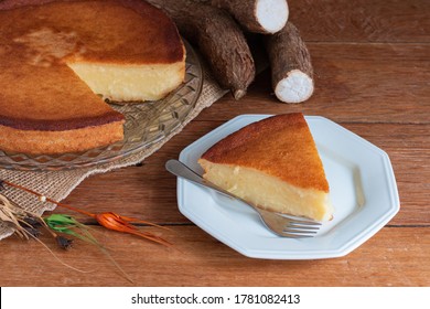 Cassava cake on wooden background. Cut piece