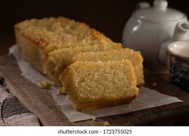 Cassava cake slices in a rustic  wood, dark background, selective focus
