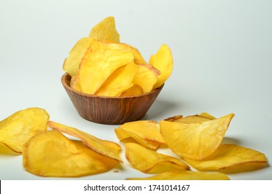 Cassava chips isolated on white background. Cassava chips is salted and crunchy crackers for the snack, and it is one of the Asian popular snack - Shutterstock ID 1741014167