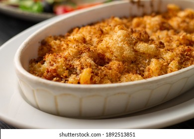 Casserole Or Lasagna Sprinkled With Breadcrumbs In White Oval Ceramic Baking Dish