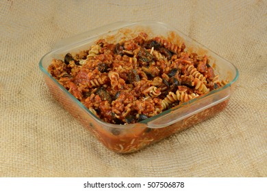 Casserole Preparation Of Cooked Whole Wheat Rotini Pasta, Ground Cooked Turkey Meat, Sliced Black Olives And Tomato Sauce In Glass Baking Dish