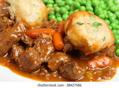 Casseroled Beef Stew With Suet Dumplings And Peas