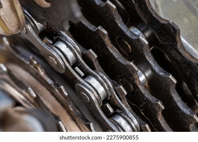 Cassette and chain of a mountain bike close-up on a black background