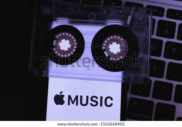 Cassette and phone screen with the Apple\
Music logo which is the Apple Streaming music service\
Sunday,\
November 17, 2019, New York, United\
States.