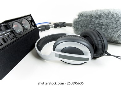 Cassette Recorder, Boom Mic And Headphones Over White