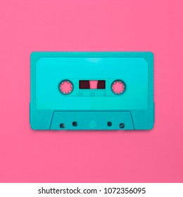 Cassette tape close up, blank for customisation of label, isolated and presented in punchy pastel colors, for nostalgic 90s creative design cover, poster, book, flyer, magazine, card, web & print