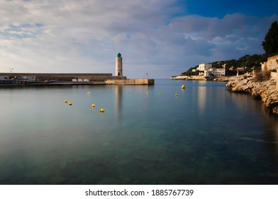 Cassis, France - 01 22 2016: General View Of The Port Of Cassis, French Riviera, With The Lighthouse And The Dyke At Sunrise.