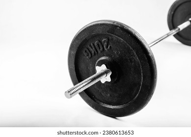 Cast iron disc from a barbell on a white background.