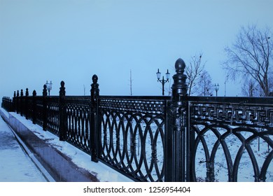 Cast Iron Fence In The Park In The Winter. Inclement Weather, Snow.