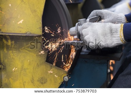 cast iron grinding by an abrasive stone ; sparks

