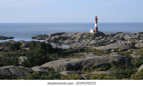 Cast iron Eigerøy lighthouse, rock formations and sea, Norway. - Powered by Shutterstock