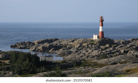 Cast iron Eigerøy lighthouse, rock formations and North Sea, Norway. - Powered by Shutterstock