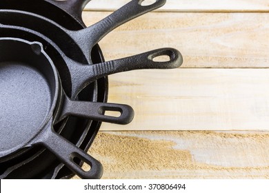 Cast iron skillet on rustic wood table.