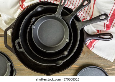 Cast iron skillet on rustic wood table.
