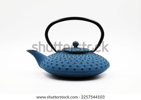 Cast iron teapot isolated on white background.