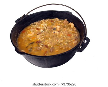 A Caste Iron Pot Of Seafood Gumbo On A White Background