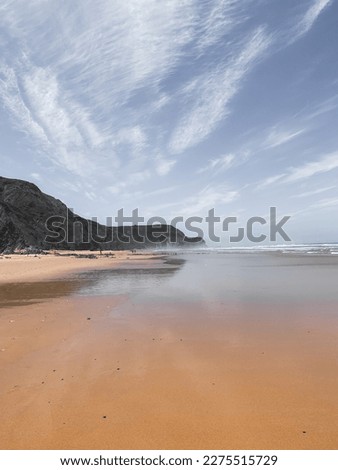 Similar – Aerial Drone View Of Blue Ocean Waves And Beautiful Sandy Beach Shore in Portugal