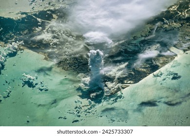 Castellanus Cloud Tower. A massive cloud rises above Andros Island in the Bahamas. Elements of this image furnished by NASA.