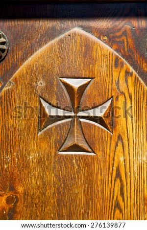 castellanza blur lombardy   abstract   rusty brass brown knocker in a  door curch  closed wood italy   cross 