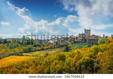 Castellina in Chianti village, vineyard and autumn foliage. Tuscany, Italy. Europe.