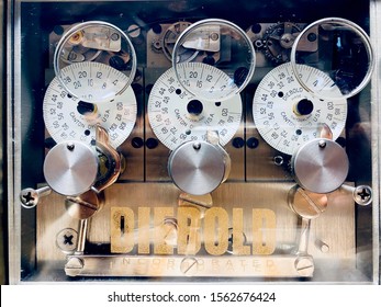 
A Caster, Ohio / USA - November 2019: Diebold 3 In Case Bank Vault Safe Timer Clock In An Unused Bank.  Made By Diebold Safe And Lock Company In Canton, Ohio. Old Vintage Antique Bank Timer.