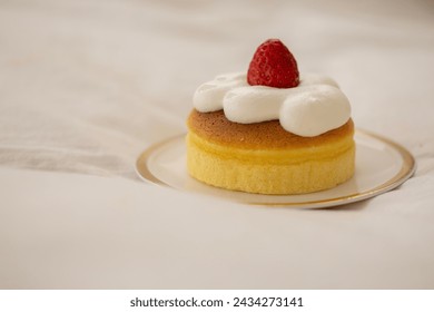 Castera with strawberries and whipped cream on top - Powered by Shutterstock