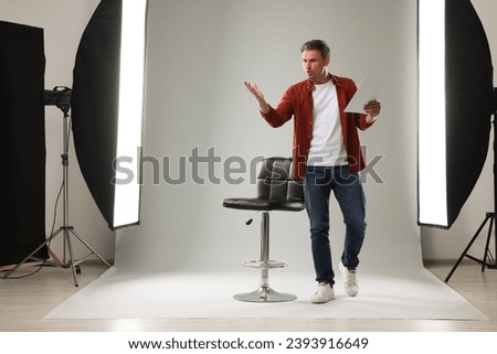 Casting call. Man with script performing in studio