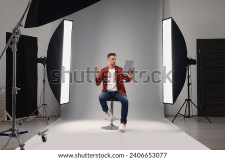 Casting call. Man with script performing in studio