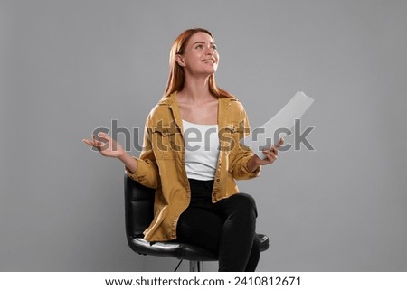 Casting call. Young woman with script performing on grey background ストックフォト © 