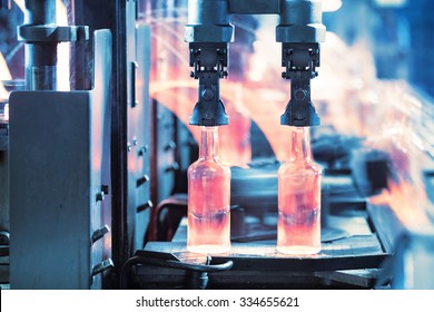 Casting glass bottles on the conveyor - Powered by Shutterstock