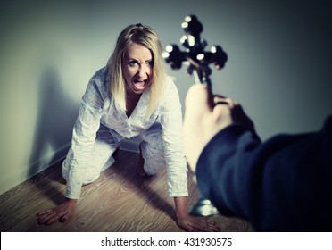  Casting out a demon from a woman through prayer. Exorcisms over deranged and crazy person. - Shutterstock ID 431930575