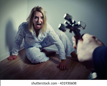  Casting out a demon from a woman through prayer. Exorcisms over deranged and crazy person. - Shutterstock ID 431930608