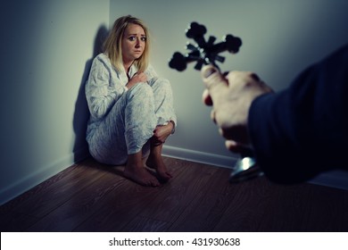  Casting out a demon from a woman through prayer. Exorcisms over deranged and crazy person. - Shutterstock ID 431930638