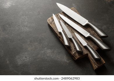 Casting steel various chef knife, Set of modern sharp kitchen knives on dark background - Powered by Shutterstock