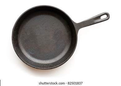 Cast-iron frying pan isolated on white background with shadow
