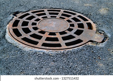 Water Flows Through Manhole Cover Melting Stock Photo (Edit Now) 1923214034