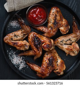 Cast-iron Pan With Bbq Chicken Wings, Close-up, Flat-lay View