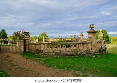 Castle Ashby Gardens offer a stunning blend of lush greenery, manicured lawns, and picturesque landscapes surrounding the historic estate, showcasing classic British elegance - Powered by Shutterstock