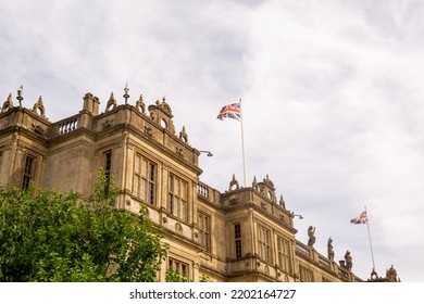 Castle With British Flags Against Blue Sky Background