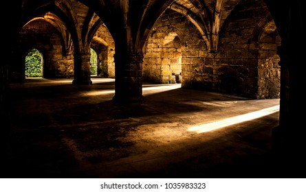 Castle chamber flooded with golden sun. Sun rays and shadows. Big contrast.